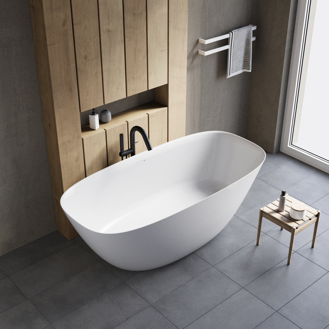 Freistehende Badewanne aus Mineralguss in modernem Badezimmer mit Natursteinboden – stilvoll, zeitlos und hochwertig